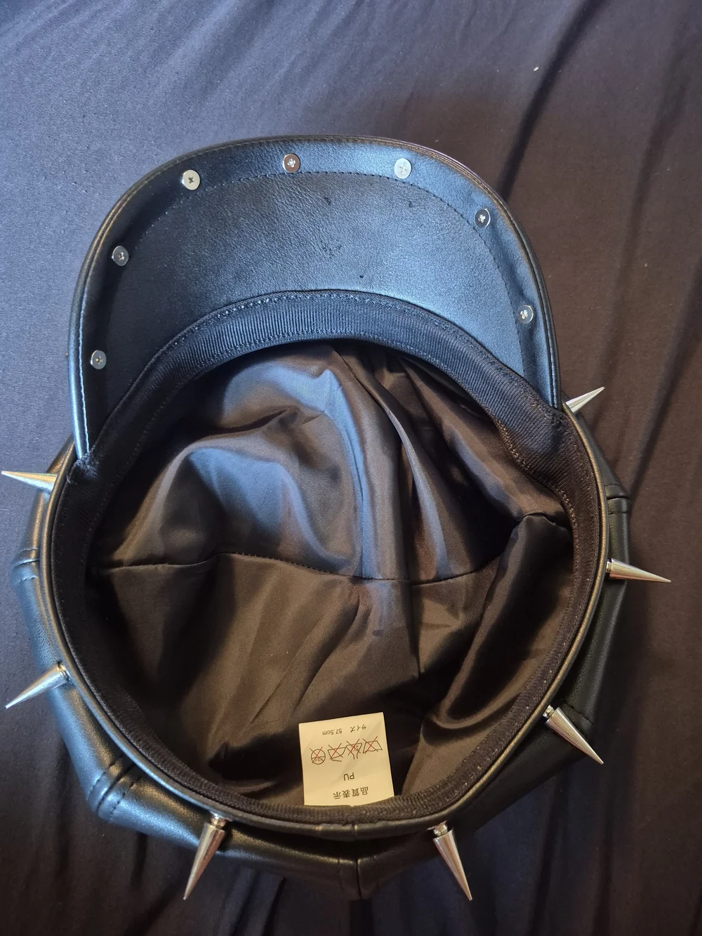 Black Faux Leather Spiked Cap with Skull Accent